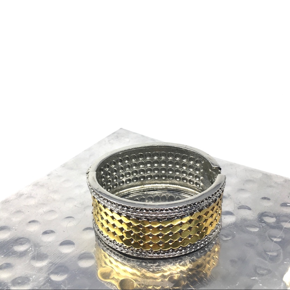 Silver and gold tone bangle hinged bracelet